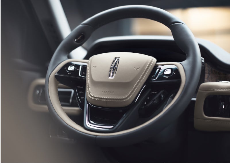 The intuitively placed controls of the steering wheel on a 2023 Lincoln Aviator® SUV | Lincoln of Ramsey in Ramsey NJ