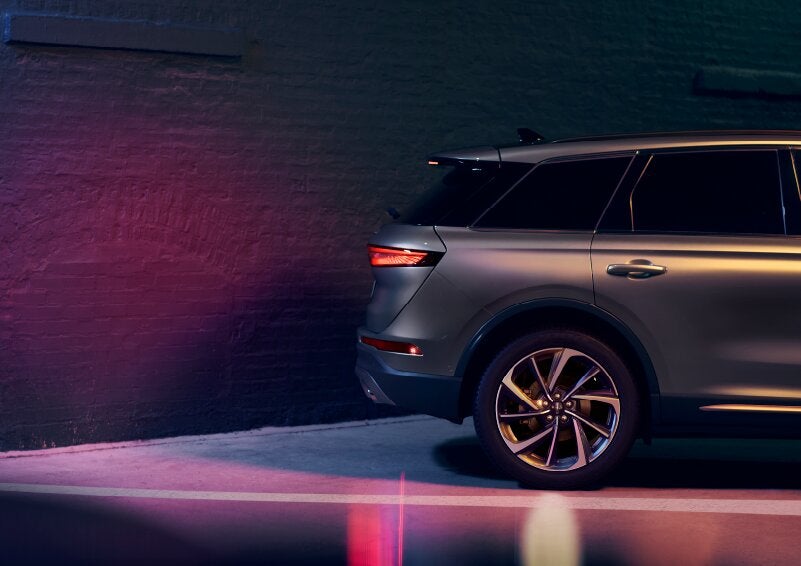 A dramatization of a 2025 Lincoln Corsair® SUV is shown backing up toward a wall. | Lincoln of Ramsey in Ramsey NJ