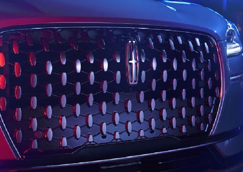 The grille of a 2025 Lincoln Corsair® SUV reflects neon light at night. | Lincoln of Ramsey in Ramsey NJ
