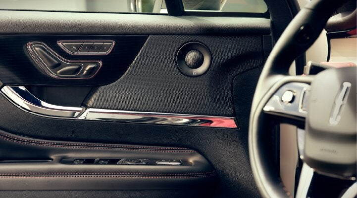 A Revel® audio speaker is shown in the driver's side door of a 2025 Lincoln Corsair® SUV. | Lincoln of Ramsey in Ramsey NJ