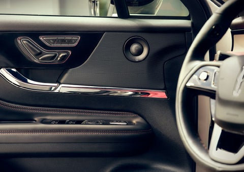 The driver of a 2024 Lincoln Corsair® SUV is shown selecting the drive mode. | Lincoln of Ramsey in Ramsey NJ