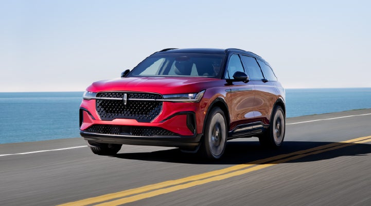 A 2025 Lincoln Nautilus® SUV is being driven on a seaside roadway. | Lincoln of Ramsey in Ramsey NJ