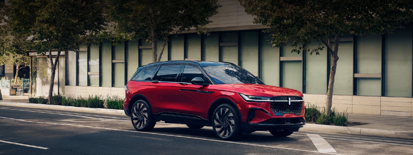 A 2025 Lincoln Nautilus® SUV with an available hybrid powertrain is parked in an urban setting. | Lincoln of Ramsey in Ramsey NJ