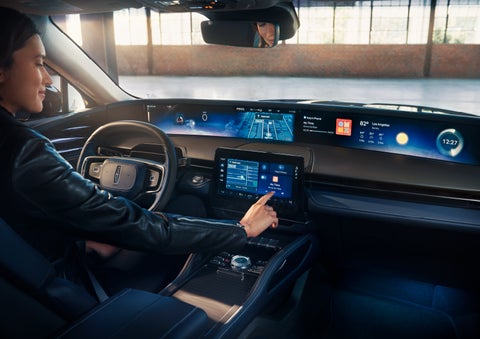 The driver of a 2025 Lincoln Nautilus® SUV interacts with the center touchscreen. | Lincoln of Ramsey in Ramsey NJ