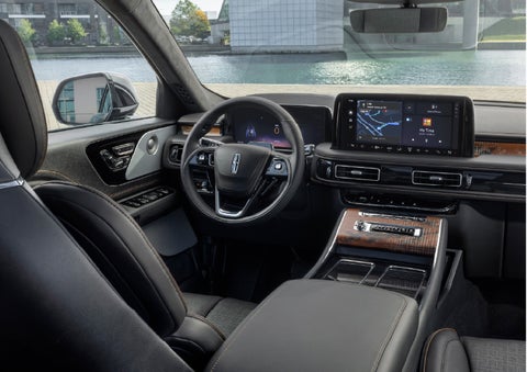 The interior of the 2026 Lincoln Aviator® SUV is shown parked with a view of a harbor through the windshield. | Lincoln of Ramsey in Ramsey NJ