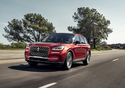 A 2026 Lincoln Corsair® SUV is shown being driven on a country road. | Lincoln of Ramsey in Ramsey NJ