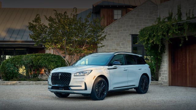 A 2026 Lincoln Corsair® SUV is parked in front off a luxury home. | Lincoln of Ramsey in Ramsey NJ