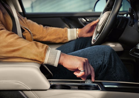 The driver of a 2026 Lincoln Corsair® SUV is shown selecting a drive mode. | Lincoln of Ramsey in Ramsey NJ