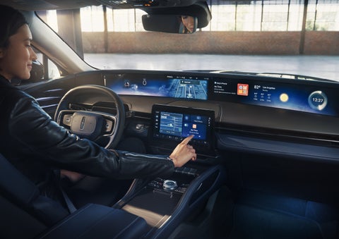 The driver of a 2026 Lincoln Nautilus® SUV interacts with the center touchscreen. | Lincoln of Ramsey in Ramsey NJ