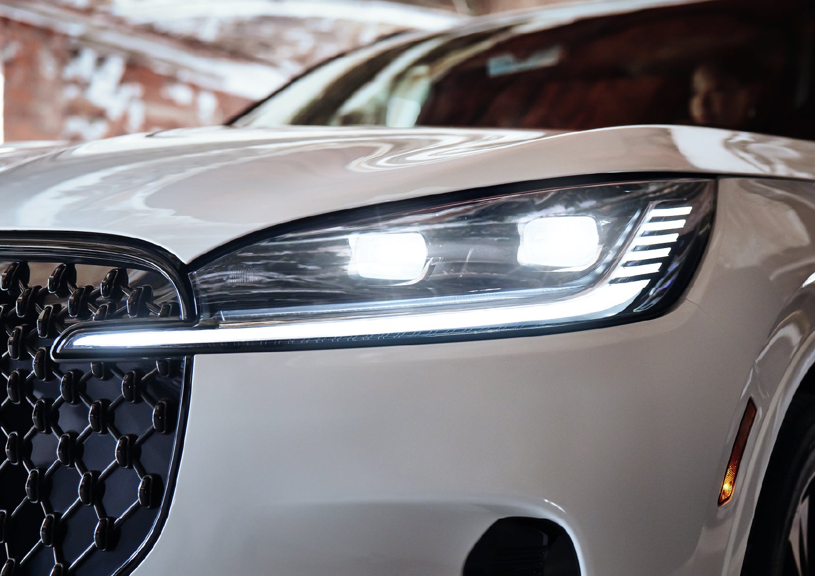 A close-up of a headlamp on the 2027 Lincoln Aviator® SUV is shown. | Lincoln of Ramsey in Ramsey NJ