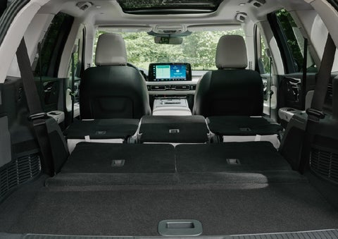 A rear to front view of the interior of a 2027 Lincoln Aviator® Black Label™ SUV shows the third and second rows folded flat | Lincoln of Ramsey in Ramsey NJ